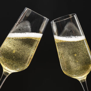 Two festive champagne glasses celebration